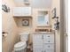 Cozy bathroom with white vanity, granite countertop, and decorative nautical accents at 1105 Lampwick Ln., Murrells Inlet, SC 29576