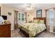 Cozy bedroom with natural light, hardwood floors, and a queen-sized bed at 1105 Lampwick Ln., Murrells Inlet, SC 29576