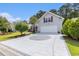 Spacious driveway with decorative pattern leading to a two-car garage at 1105 Lampwick Ln., Murrells Inlet, SC 29576