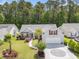 Charming single-Gathering home with lush landscaping and inviting front yard at 1105 Lampwick Ln., Murrells Inlet, SC 29576