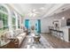 Sunroom featuring wood floors, bar seating, and lots of natural light at 1105 Lampwick Ln., Murrells Inlet, SC 29576