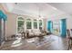 Sunroom with lots of natural light, wood floors, and views of backyard at 1105 Lampwick Ln., Murrells Inlet, SC 29576