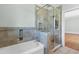 Bathroom featuring tiled bath and shower at 115 Ford Ave, Mullins, SC 29574