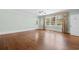 Neutral bedroom with hardwood floors, large window, ceiling fan, and trim at 115 Ford Ave, Mullins, SC 29574
