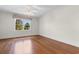 Bedroom with hardwood floors and large window at 115 Ford Ave, Mullins, SC 29574
