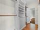 Walk-in closet with custom built-in shelving for ample storage space at 115 Ford Ave, Mullins, SC 29574
