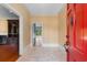 Inviting entryway with a red front door, neutral walls, and tiled flooring at 115 Ford Ave, Mullins, SC 29574