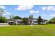 Charming single story home with lush landscaping and a well-maintained lawn on a sunny day at 115 Ford Ave, Mullins, SC 29574