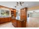 Bright kitchen with an island, stainless appliances, built-in cabinets, and tiled flooring at 115 Ford Ave, Mullins, SC 29574