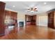Cozy living room featuring hardwood floors, built-in cabinetry, and a cozy fireplace at 115 Ford Ave, Mullins, SC 29574
