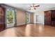 Spacious living room with hardwood floors, built-in cabinetry and views to the exterior at 115 Ford Ave, Mullins, SC 29574