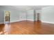 Main bedroom with hardwood floors, and ensuite bathroom at 115 Ford Ave, Mullins, SC 29574