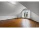 Bright attic space with dormer window and wood-paneled walls at 118 Ford Ave, Mullins, SC 29574