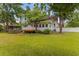 Spacious backyard featuring a gazebo, large deck, and ample green space at 118 Ford Ave, Mullins, SC 29574