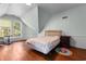 Spacious bedroom with hardwood floors, light-colored walls, and a large window offering natural light at 118 Ford Ave, Mullins, SC 29574