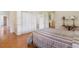 Bedroom with parquet floors, neutral colored walls, and a large closet at 118 Ford Ave, Mullins, SC 29574