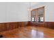 Traditional dining room with hardwood floors, wood paneling, and chandelier at 118 Ford Ave, Mullins, SC 29574