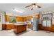 Kitchen with stainless steel appliances, center island, ceiling fan, and wooden cabinets at 118 Ford Ave, Mullins, SC 29574