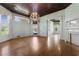 Spacious living room with hardwood floors, fireplace, and lots of windows letting in natural light at 118 Ford Ave, Mullins, SC 29574