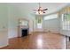Living room featuring parquet floors, fireplace, and lots of natural light at 118 Ford Ave, Mullins, SC 29574
