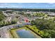 A picturesque view of the blue condos near a pond, complemented by lush trees and proximity to the ocean at 1356 Glenns Bay Rd. # 202H, Myrtle Beach, SC 29575