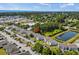 An aerial view showcases the condos nestled among green trees, conveniently located near a pond at 1356 Glenns Bay Rd. # 202H, Myrtle Beach, SC 29575