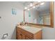 This bathroom features a single sink vanity with a framed mirror and granite countertops at 1356 Glenns Bay Rd. # 202H, Myrtle Beach, SC 29575