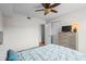 The bedroom features a ceiling fan, closet, and dresser with a TV at 1356 Glenns Bay Rd. # 202H, Myrtle Beach, SC 29575