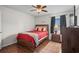 Cozy bedroom with a queen bed, ceiling fan, and neutral decor at 1356 Glenns Bay Rd. # 202H, Myrtle Beach, SC 29575