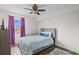 This bedroom features a window, a ceiling fan, and wood flooring at 1356 Glenns Bay Rd. # 202H, Myrtle Beach, SC 29575
