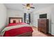 Comfortable bedroom with a queen bed, ceiling fan, and neutral decor at 1356 Glenns Bay Rd. # 202H, Myrtle Beach, SC 29575