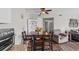 Charming dining area with hardwood floors, a stylish table, and a hutch for added storage at 1356 Glenns Bay Rd. # 202H, Myrtle Beach, SC 29575