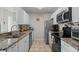 Modern kitchen with granite counters, stainless appliances and white cabinets at 1356 Glenns Bay Rd. # 202H, Myrtle Beach, SC 29575