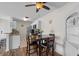 Inviting kitchen and dining area featuring white cabinets, stainless steel appliances, and wood-look flooring at 1356 Glenns Bay Rd. # 202H, Myrtle Beach, SC 29575