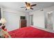 This main bedroom features a ceiling fan, a TV, and an attached bathroom at 1356 Glenns Bay Rd. # 202H, Myrtle Beach, SC 29575