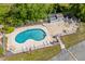 Aerial view of the community pool offering a refreshing escape with lounge chairs for sunny relaxation at 1356 Glenns Bay Rd. # 202H, Myrtle Beach, SC 29575