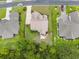 Aerial view of a home featuring a fenced backyard, patio area, and lush greenery, offering a private outdoor space at 1367 Bermuda Grass Dr., Myrtle Beach, SC 29579