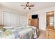 Bright bedroom featuring closets, a ceiling fan, and an ensuite bathroom at 1367 Bermuda Grass Dr., Myrtle Beach, SC 29579