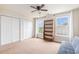 Bright bedroom with carpet, ceiling fan, natural light, and ample closet space at 1367 Bermuda Grass Dr., Myrtle Beach, SC 29579