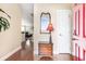 Inviting entryway with hardwood floors, decorative mirror, and view into the living space at 1367 Bermuda Grass Dr., Myrtle Beach, SC 29579