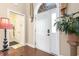 Bright entryway featuring tile flooring, arched doorway, and a decorative houseplant at 1367 Bermuda Grass Dr., Myrtle Beach, SC 29579