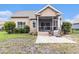 Charming exterior of the home including screened porch and manicured landscaping at 1367 Bermuda Grass Dr., Myrtle Beach, SC 29579