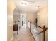 Upstairs hallway leading to the bedrooms and other living spaces with a wooden banister at 1367 Bermuda Grass Dr., Myrtle Beach, SC 29579