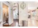 Hallway featuring a powder room, hardwood floors, and white trim at 1367 Bermuda Grass Dr., Myrtle Beach, SC 29579