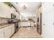 Bright kitchen featuring white cabinets, granite countertops, and stainless steel appliances at 1367 Bermuda Grass Dr., Myrtle Beach, SC 29579