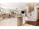 Open kitchen featuring white cabinets, granite countertops, and stainless steel appliances at 1367 Bermuda Grass Dr., Myrtle Beach, SC 29579
