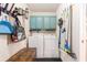 Practical laundry room with a washer, dryer, and storage cabinets for household necessities at 1367 Bermuda Grass Dr., Myrtle Beach, SC 29579