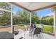 View of screened in porch and outdoor seating area with views of landscaping at 1367 Bermuda Grass Dr., Myrtle Beach, SC 29579