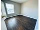 Cozy bedroom with wood floors, bright window, and neutral wall paint at 1432 Highway 544 # B2, Conway, SC 29526