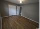 Comfortable bedroom with wood floors, ample closet space, and neutral gray walls at 1432 Highway 544 # B2, Conway, SC 29526